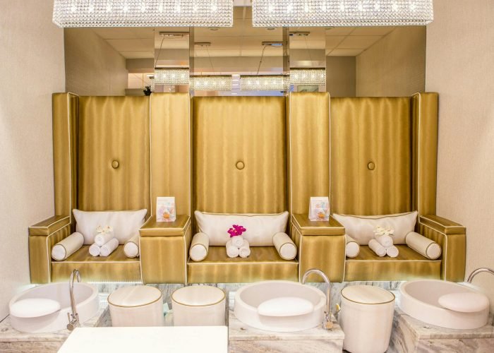 Elegant and contemporary spa interior featuring luxurious pedicure stations for relaxation.